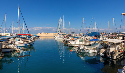 Fototapeta na wymiar Panoramic view of yacht port and marina at Mediterranean coastline beneath Old City of Jaffa in Tel Aviv Yafo, Israel