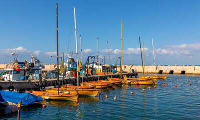 Panoramic view of yacht port and marina at Mediterranean coastline beneath Old City of Jaffa in Tel...