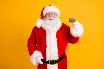 Fototapeta na wymiar Grey beard fat fairy magic miracle santa claus cap headwear hold credit card recommend pay x-mas christmas jolly holly party purchase wear belt isolated bright shine color background