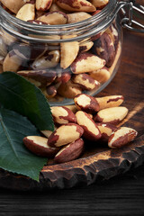 Open jar filled with Brazil nuts close up