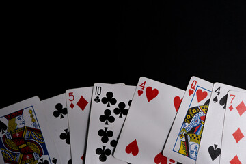 Playing cards - isolated on black background