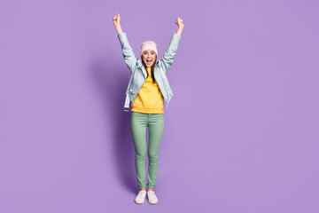 Full length photo of crazy attractive lady good mood raise arms up excited funky cheerful wear...