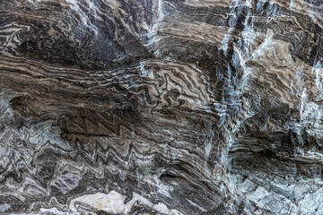 Abstract gray texture of natural, raw salt in an underground salt mine