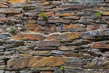 Architecture textures, detailed rusty and rustic old wall masonry schist