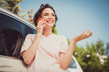 Photo of positive girl car driver rider call friend suggest tell say friend summer vacation drive...