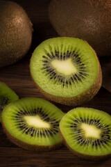 Ripe fresh kiwi cut on a wooden close-up background