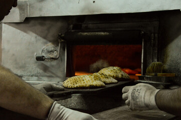 Traditional Bosnian Somun flatbread bread being prepared in a bakery in the capital of Sarajevo