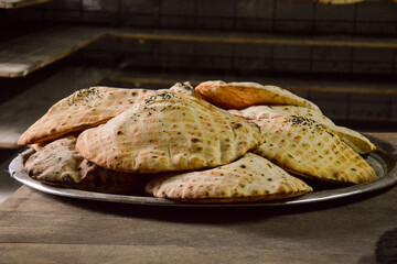 Traditional Bosnian Somun flatbread bread being prepared in a bakery in the capital of Sarajevo