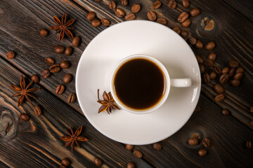 White cup of coffee on a wooden background