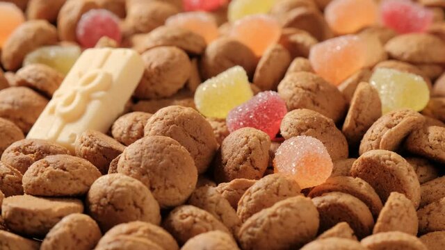 Background for Dutch holiday Sinterklaas. Rotation of kruidnoten, traditional sweets, strooigoed. St. Nicolas day concept. 4K video, 50 fps