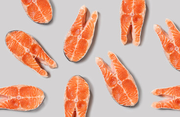 Top view of raw salmon steak isolated on grey background. Minimal concept. Flat lay
