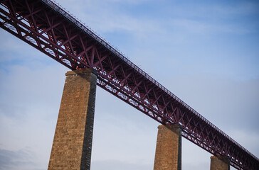 bottom up view of the railway bridge, evening sun, blue sky