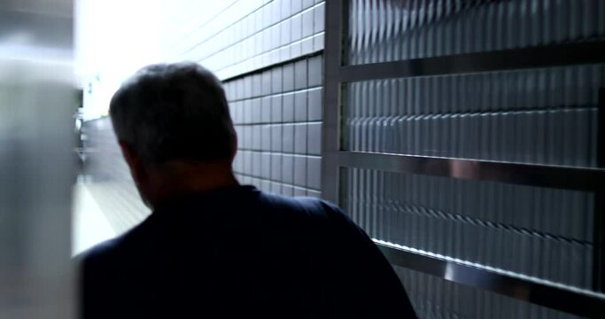 Old man arriving home opening back door. Senior opens door arrives home