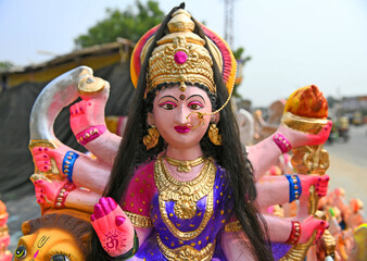 Idol of Hindu Goddess Durga, wearing golden nose ring. Nine-day Durga Puja festival, which commemorates the slaying of demon king Mahishasur by goddess Durga, marks triumph of good over evil.