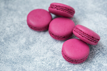 Macaron cookies with black currants close-up