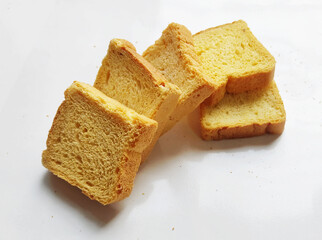 crispy rusk, cake rusk, cardamom rusk, Crunchy or Toast for healthy life, Traditional biscuit tray with tea, toasts for breakfast and cup of fresh milk & Tea, dry toasty bread, crunchy toast, pau,