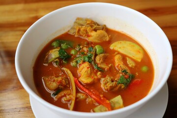 Chicken jungle curry in white bowl. Thai traditional food. Food concept.