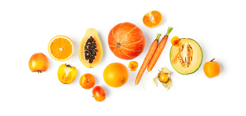 Different orange fruits and vegetables creative composition.