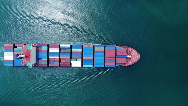 Aerial top view of cargo ship carrying container running  for export import near  cargo yard port concept freight shipping by cargo ship , webinar banner