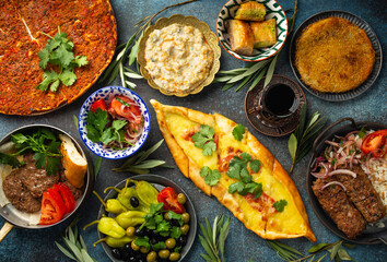 Traditional Turkish food, assorted dishes and mezze appetizers on rustic background from above....