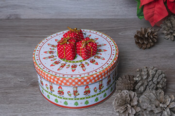 red christmas gifts on a box of cookies