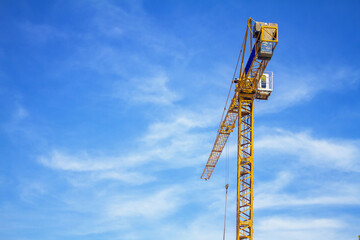 yellow crane on blue sky background