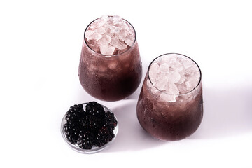 Fresh blackberry cocktail in cold glass isolated on white background