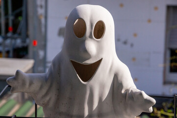 Scary halloween ghost figur in the sun of a balcony