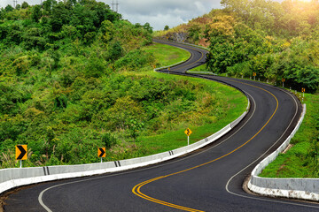 Road no.3 or sky road over top of mountains with green jungle in Nan province, Thailand. © tawatchai1990