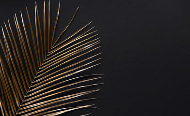 Obraz premium Closeup of golden palm leaves on black background. Copy space. Flat lay. Luxury invitation card template.