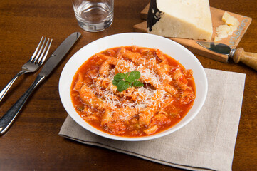 tripe with tomato sauce called tripe alla romana, a typical dish from Lazio on table
