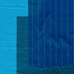 Blue torn paper collage close-up. Texture made from various paper and cardboard parts. Damaged old paper background. Vintage blank wallpaper. Material design backdrop.