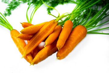 Orange useful carrot vitamins. Food for vegans. Isolated on a white background