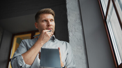 Thinking man at the window