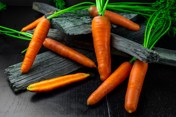Organic farm carrots on a black background. A healthy diet