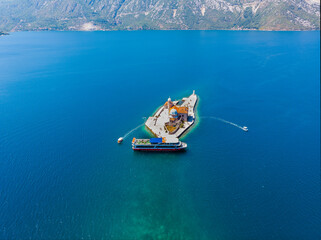 Island of Our Lady of The Rocks in kotor bay in montenegro. Aerial drone view