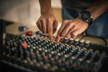 Behind the scene. Sound technician electric engineer adjusting sound elements backstage. Control...