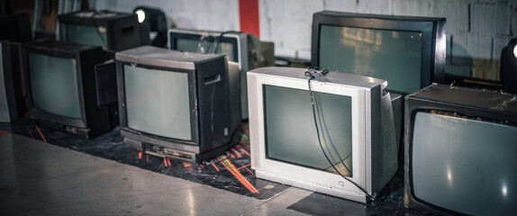 Stack of retro vintage televisions stacked. Lifestyle details, old TV set