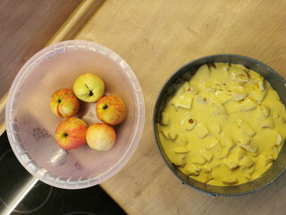 Cooking autumn charlotte pie. Round dough for apple pie. Bananas on the table. Step one. Homemade baking concept.