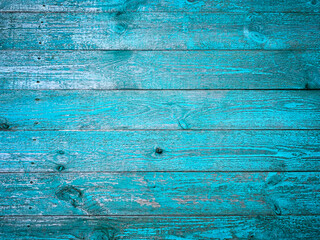 natural wood background, old shabby planks painted with turquoise paint, selective focus