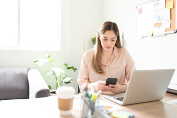 Businesswoman using a smartphone in an office