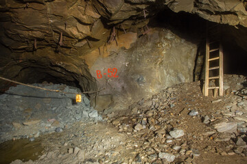 Underground gold ore mine tunnel with ladder stairs