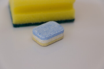 dishwasher tablet with yellow sponge