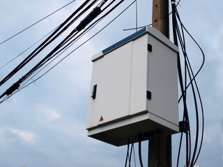 Internet control cabinet on a pole. NODE is a box that combines the cables of High speed internet...