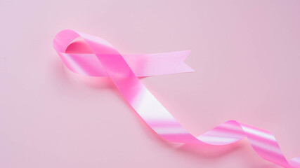 Pink ribbons on pink background , Breast cancer awareness, abdominal cancer awareness , world cancer day