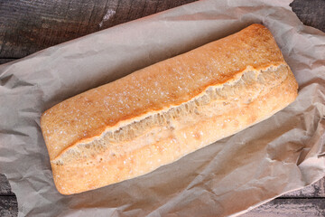 Traditional Italian crispy ciabatta bread on paper.