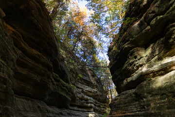 Fototapeta na wymiar Autumn in Starved Rock State Park, a wilderness area on the Illinois River in the U.S. state of Illinois. Steep sandstone canyons formed by glacial meltwater. Utica.