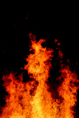 Fototapeta na wymiar big flames of fire, tongues of fire on black background, blurred motion