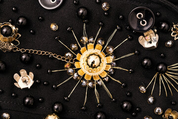 Golden metal flower embroidery with crystal beads around