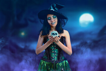 Young witch in halloween night with skull.